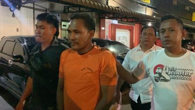 Ketua Pemuda Pancasila, Imran Surbakti saat digelandang petugas Polrestabes Medan beberapa waktu lalu.