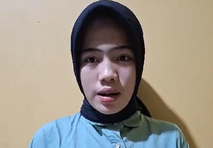 Khoirunnisa (18), wanita yang paksa kucing merokok di Kota Tebingtinggi minta maaf setelah viral.