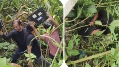 Polisi saat menemukan barang bukti laptop yang dibuang komplotan perampok ke jurang di kawasan Kabupaten Simalungun. Ada tiga pelaku lagi diburu.